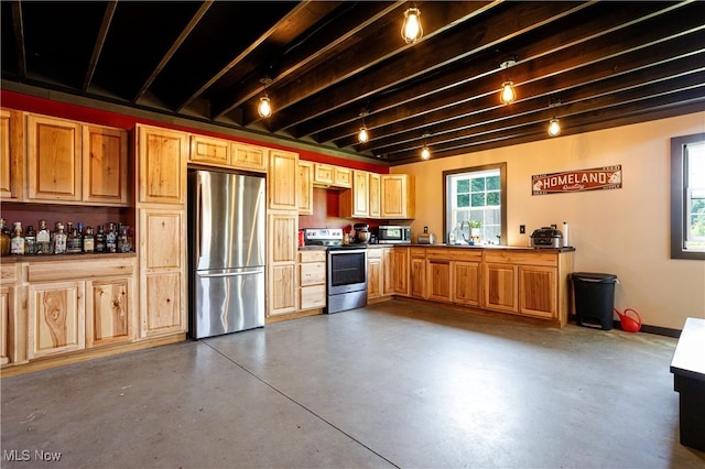 kitchen with appliances with stainless steel finishes, concrete flooring, and beam ceiling
