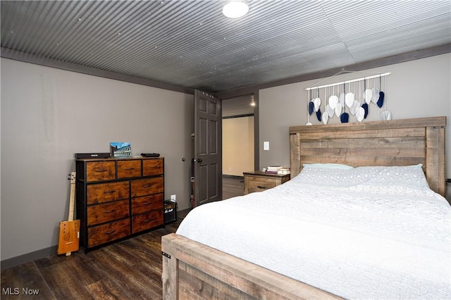 bedroom with wood finished floors