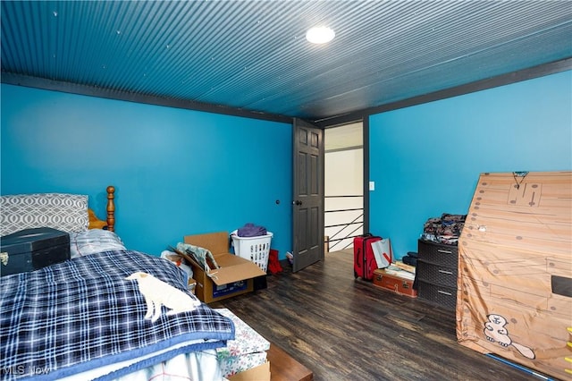 bedroom with wood finished floors