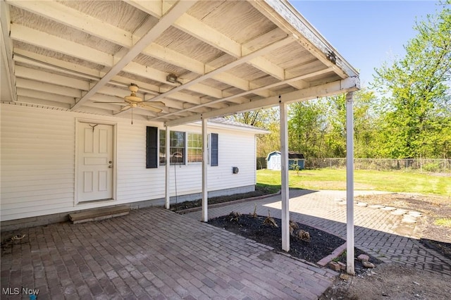 4160 Cambridge Ave, Lorain, OH 44053 - view of patio / terrace featuring a storage shed, ceiling fan, fence, and an outdoor structure