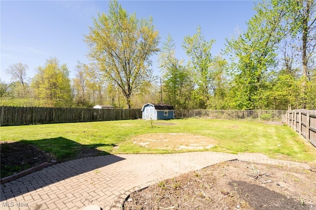 4160 Cambridge Ave, Lorain, OH 44053 - view of yard featuring an outbuilding, a fenced backyard, a patio area, and a storage unit