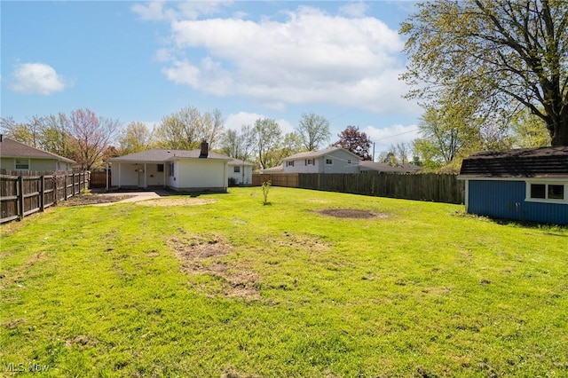 4160 Cambridge Ave, Lorain, OH 44053 - view of yard with an outbuilding, a fenced backyard, and a shed