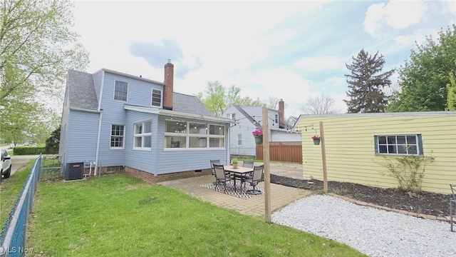 22322 Westwood Rd, Fairview Park, OH 44126 - rear view of house with a shingled roof, a chimney, a lawn, a patio, and fence private yard
