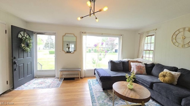22322 Westwood Rd, Fairview Park, OH 44126 - living area featuring a notable chandelier and light wood-style flooring
