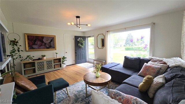 22322 Westwood Rd, Fairview Park, OH 44126 - living area featuring an inviting chandelier and light wood finished floors
