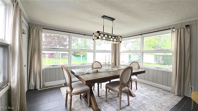 22322 Westwood Rd, Fairview Park, OH 44126 - sunroom featuring an inviting chandelier and plenty of natural light