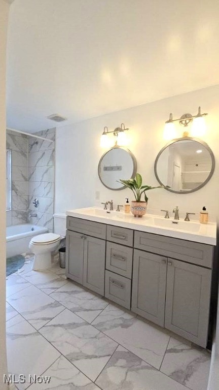 22322 Westwood Rd, Fairview Park, OH 44126 - bathroom featuring double vanity, toilet, a sink, and marble finish floor