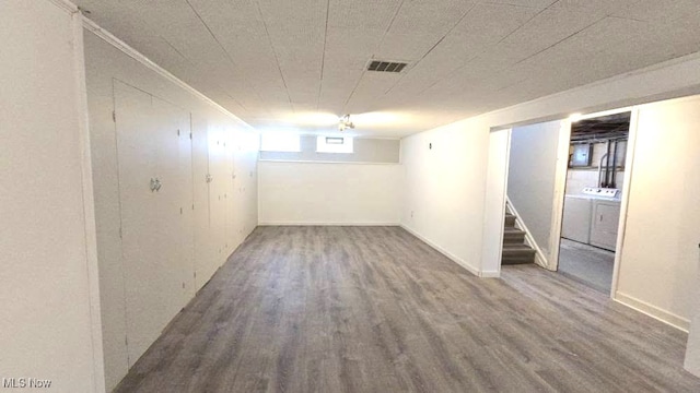 22322 Westwood Rd, Fairview Park, OH 44126 - below grade area featuring visible vents, washer and clothes dryer, stairway, and wood finished floors