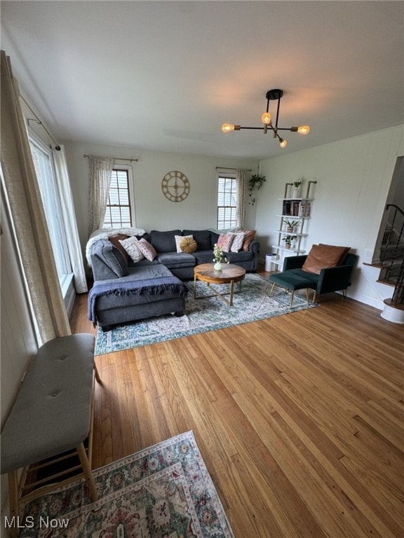22322 Westwood Rd, Fairview Park, OH 44126 - living area featuring wood finished floors and a chandelier