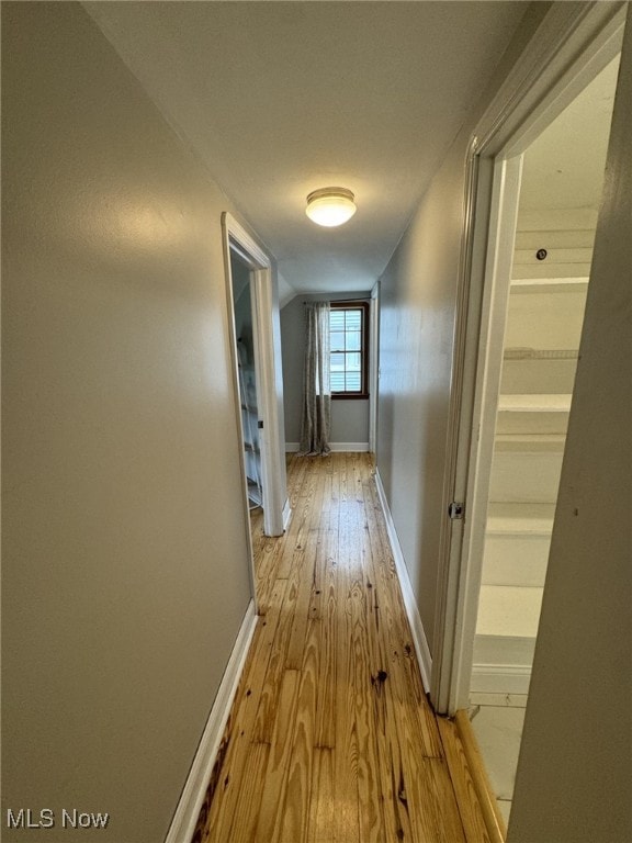 22322 Westwood Rd, Fairview Park, OH 44126 - hallway with baseboards and hardwood / wood-style floors