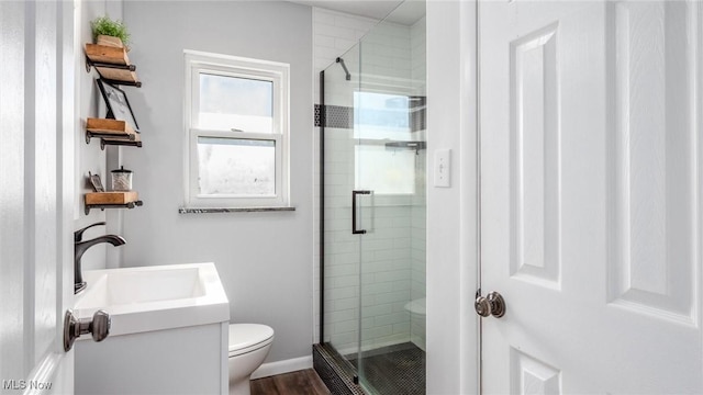 5130 Bateson Dr NE, Thornville, OH 43076 - bathroom featuring toilet, baseboards, a shower stall, and a sink