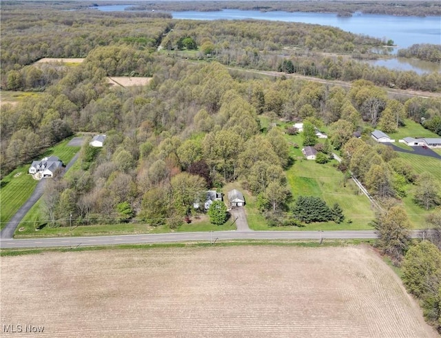 aerial view featuring a water view and a view of trees