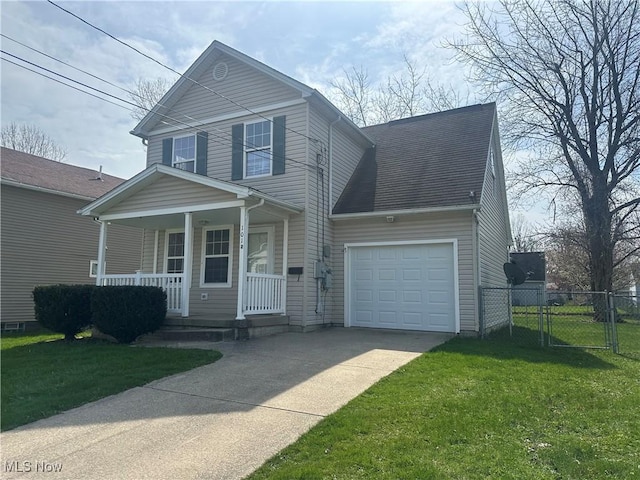 traditional home with a garage, fence, covered porch, a front yard, and driveway