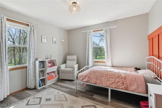 bedroom with light wood finished floors