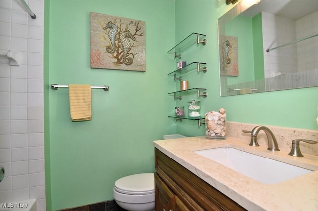 bathroom with vanity, toilet, and tub / shower combination
