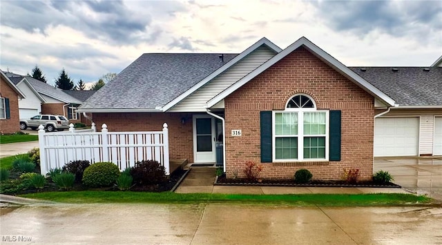 2457 Barrington Way Unit 316, Wooster, OH 44691 - ranch-style house featuring brick siding, driveway, fence, and a garage