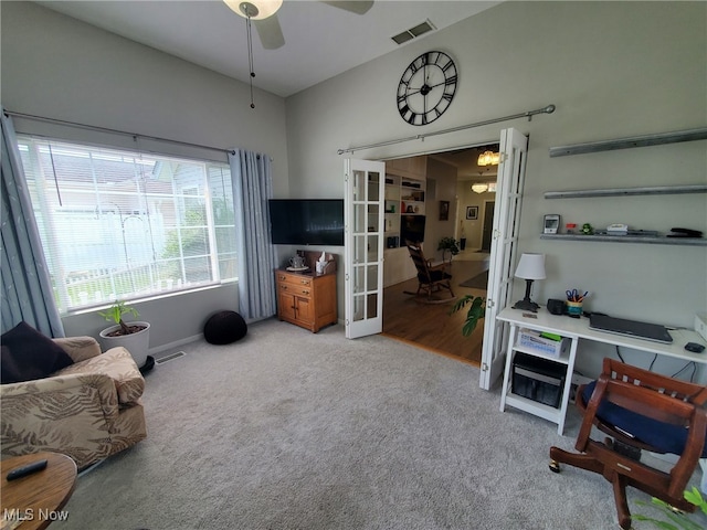 carpeted living room with visible vents, a ceiling fan, baseboards, and french doors