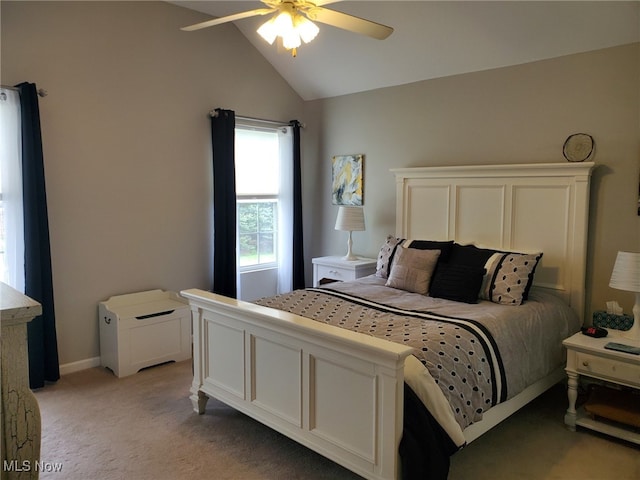 bedroom with ceiling fan, light colored carpet, and lofted ceiling