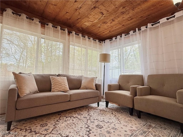 sunroom featuring wood ceiling