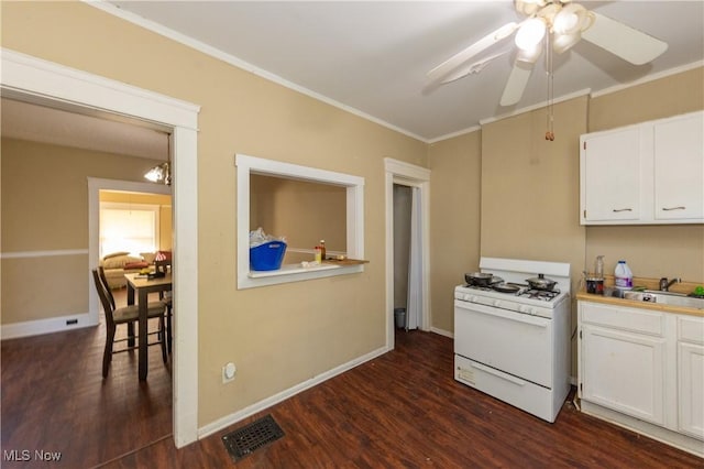 1459 W 107th St, Cleveland, OH 44102 - kitchen with crown molding, dark wood-style flooring, a sink, gas range gas stove, and visible vents
