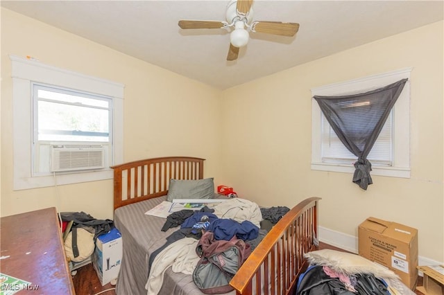 1459 W 107th St, Cleveland, OH 44102 - bedroom with baseboards, cooling unit, and a ceiling fan