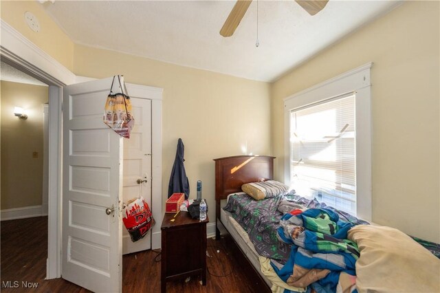 1459 W 107th St, Cleveland, OH 44102 - bedroom with baseboards, a ceiling fan, and wood finished floors