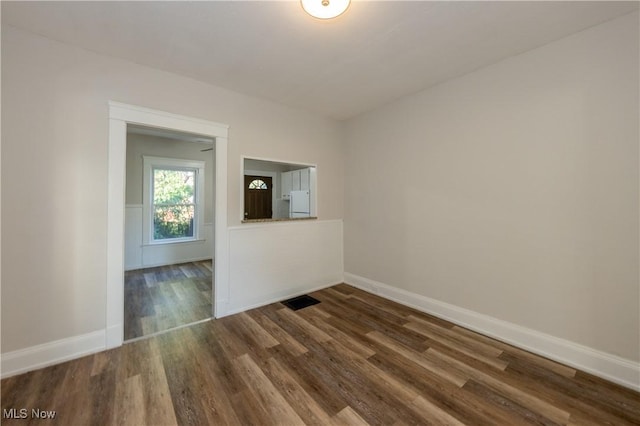 1459 W 107th St, Cleveland, OH 44102 - empty room featuring baseboards, wood finished floors, and visible vents