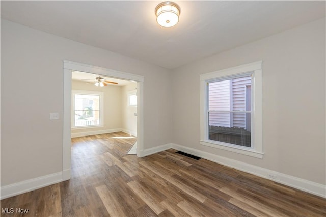 1459 W 107th St, Cleveland, OH 44102 - unfurnished room with baseboards, a ceiling fan, wood finished floors, and visible vents