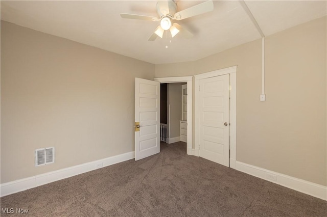 1459 W 107th St, Cleveland, OH 44102 - unfurnished bedroom featuring visible vents, a ceiling fan, baseboards, and carpet floors