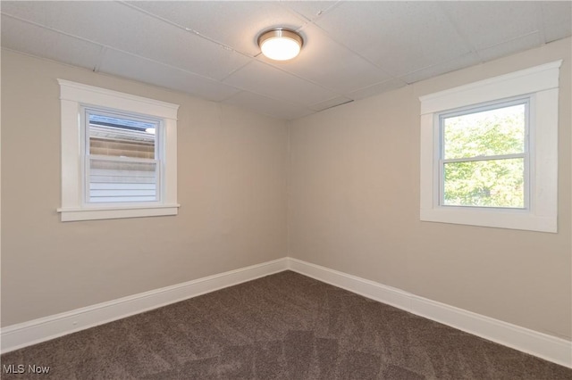 1459 W 107th St, Cleveland, OH 44102 - unfurnished room featuring baseboards and dark colored carpet