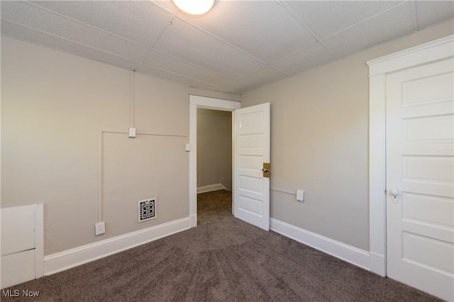 1459 W 107th St, Cleveland, OH 44102 - interior space featuring baseboards, visible vents, a drop ceiling, and dark carpet