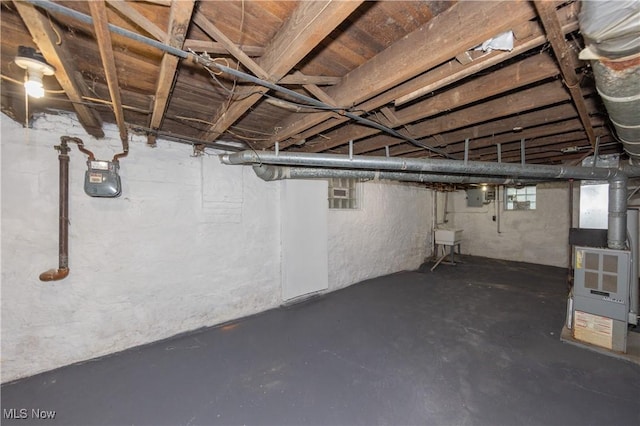 1459 W 107th St, Cleveland, OH 44102 - basement featuring a sink, heating unit, and electric panel