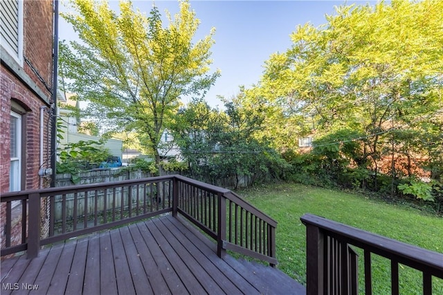 1459 W 107th St, Cleveland, OH 44102 - wooden terrace with a fenced backyard and a yard