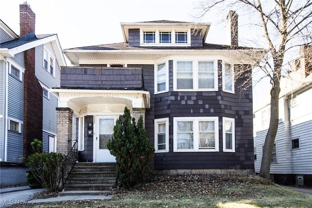 traditional style home featuring a balcony