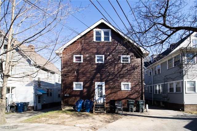 back of house featuring entry steps