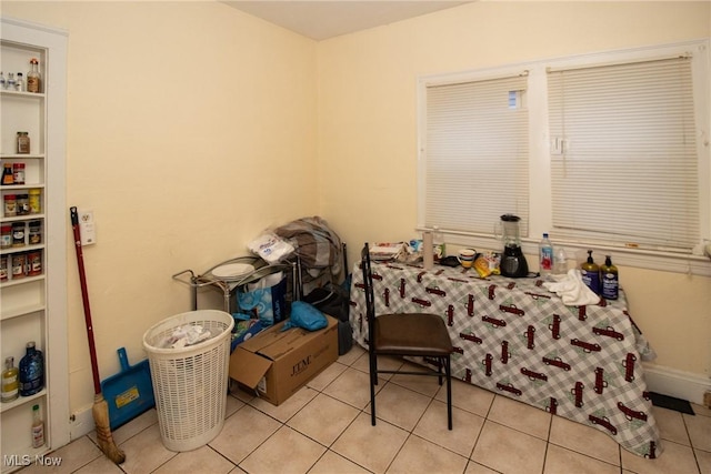 bedroom featuring light tile patterned floors