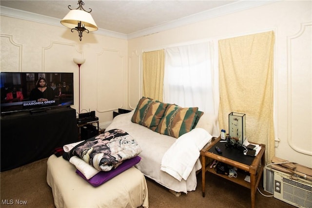 bedroom with crown molding and carpet flooring