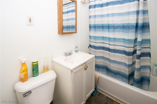 full bathroom featuring toilet, tile patterned floors, shower / tub combo with curtain, and vanity