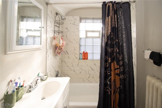 bathroom featuring radiator and vanity