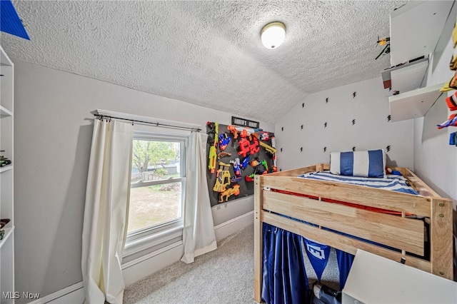 bedroom featuring a textured ceiling, vaulted ceiling, light carpet, and baseboards