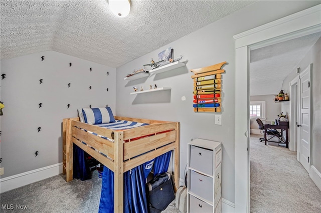 carpeted bedroom with baseboards, a textured ceiling, and lofted ceiling
