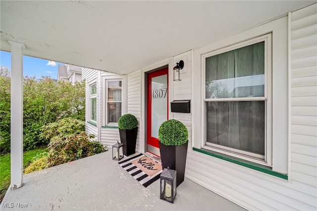 doorway to property with a porch