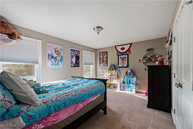 bedroom featuring carpet flooring and a closet