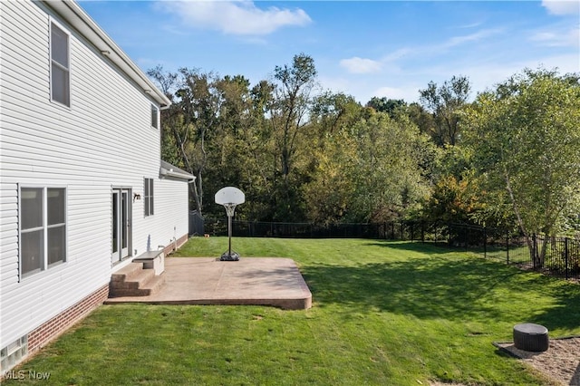 view of yard featuring a fenced backyard, a patio area, and entry steps