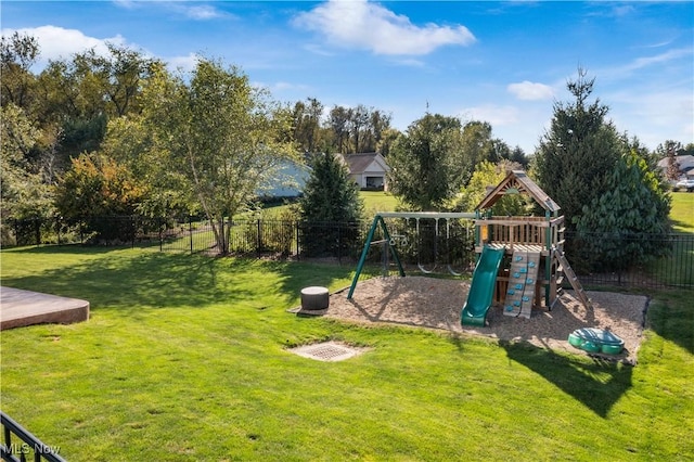 view of jungle gym with a fenced backyard and a lawn