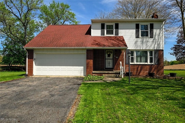 view of front of house featuring brick siding, a garage, aphalt driveway, a front yard, and a chimney