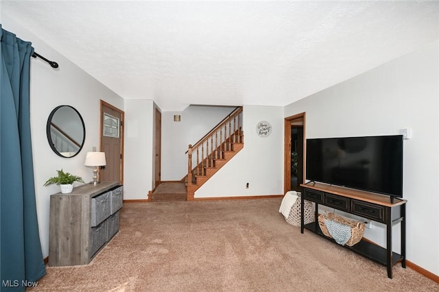 living room featuring baseboards, stairs, and light colored carpet
