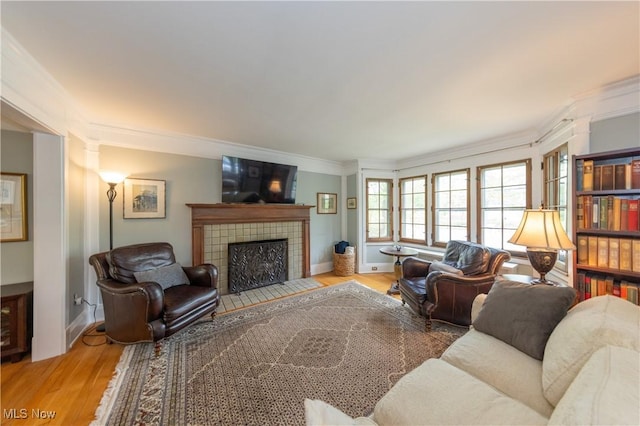 2155 Middlefield Rd, Cleveland Heights, OH 44106 - living room with baseboards, ornamental molding, a fireplace, and wood finished floors