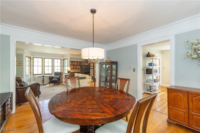 2155 Middlefield Rd, Cleveland Heights, OH 44106 - dining room with an inviting chandelier, ornamental molding, and light wood finished floors