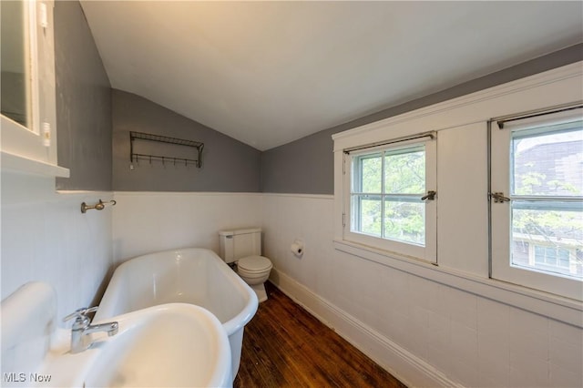 2155 Middlefield Rd, Cleveland Heights, OH 44106 - bathroom with a sink, baseboards, wood finished floors, vaulted ceiling, and a soaking tub